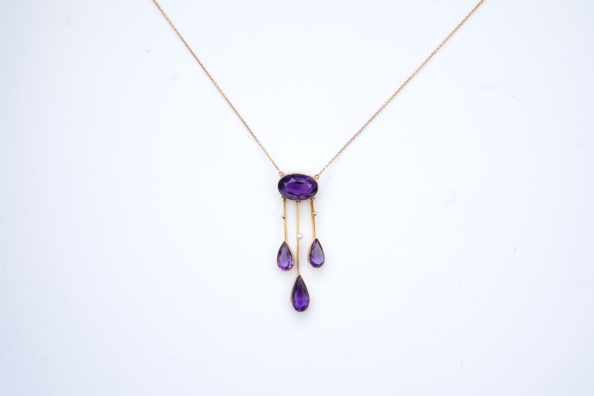 An Edwardian amethyst and seed pearl pendant, circa 1910